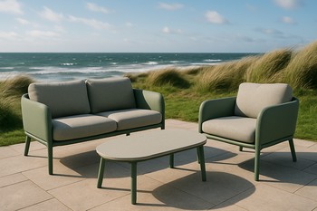 Outdoor lounge set facing the sea with light cushions and wind-friendly frames