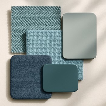 Charcoal outdoor frame with moss cushions beside a pale stone terrace