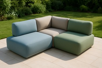 L-shaped outdoor lounge drawn along a fence with a side table at the corner