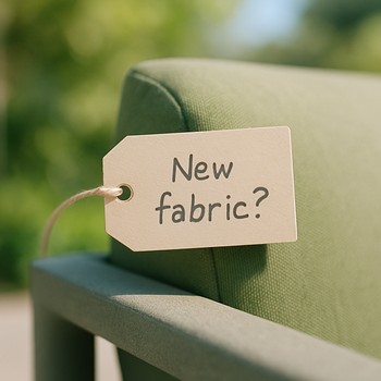 Hand resting on a note with a short list of outdoor furniture questions